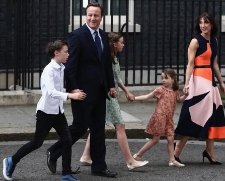 David Cameron and family take a bow from 10 Downing Street.