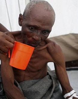 A cholera victim in Sierra Leone - and Kortu Bockarie Stevens and his friends were dining and drinking in the United States