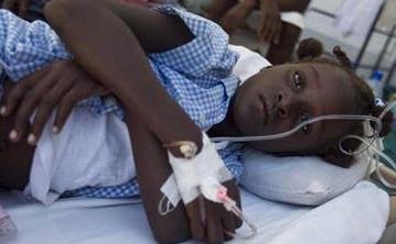 A young cholera victim receiving emergency treatment. One of the few lucky ones.