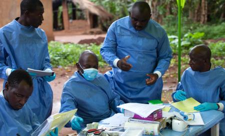 Billo Mamadou Diallo, Karamoko Sonah Camara, Alain Mukendi, Jean Francoi Tolno and Hawa Madi, Team 9 of the WHO Ebola vaccine trial, at work in Katongourou, Guinea.