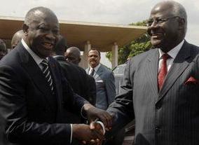 Former President Laurent Gbagbo on the left of picture...and on the right...