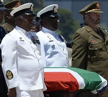 Madiba's remains in coffin draped in the South African flag. RIP 