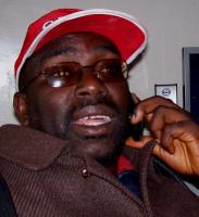 Firebrand politician Moijue wearing his red hat