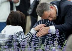 Norwegian PM Jens Stoltenberg comforts a survivor. Norway is in national mourning