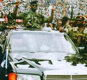 The leader of the NPRC Captain Valentine Strasser rides in triumph from the national stadium