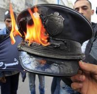 The symbol of repression - the police - a cap gets the treatment